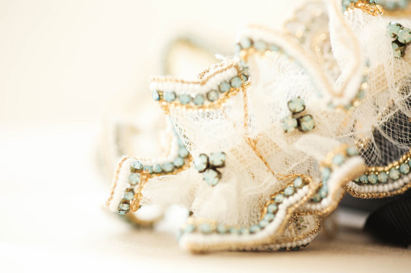 designer wedding garter in gold and aqua